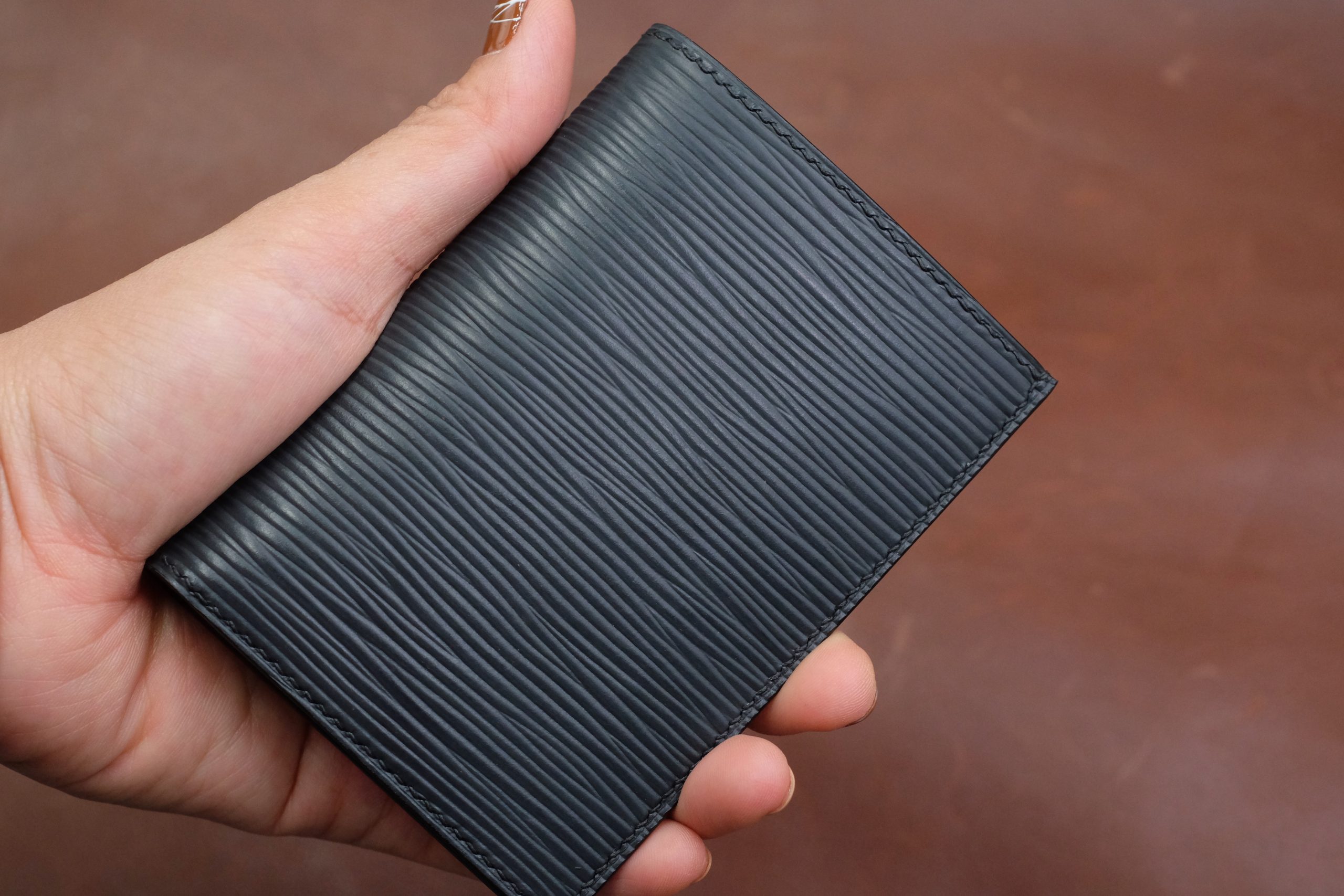 Black epi leather vertical bifold wallet HDWA53